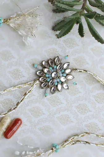 Blossoming kundan and bead work rakhi with roli chawal
