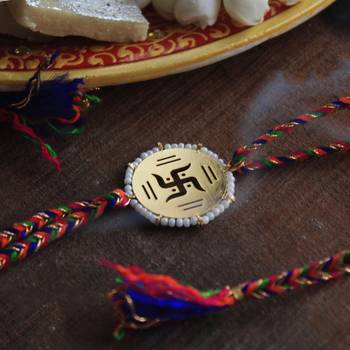 Golden beaded swastik rakhi with roli chawal 1