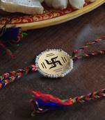 Golden beaded swastik rakhi with roli chawal