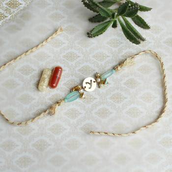 Shades of sea green stones personalised rakhi with roli chawal 1