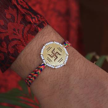 Golden beaded swastik rakhi with roli chawal 3