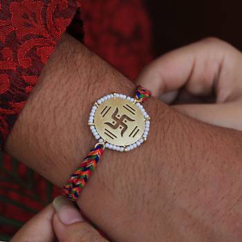Golden beaded swastik rakhi with roli chawal 4