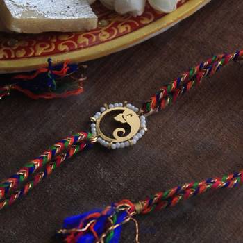 Golden beaded divinity rakhi with roli chawal 1