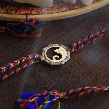 Golden beaded divinity rakhi with roli chawal 2