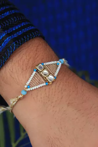 Kundan encased rakhi with roli chawal