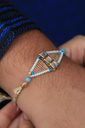 Kundan encased rakhi with roli chawal