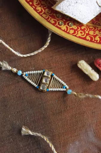 Kundan encased rakhi with roli chawal