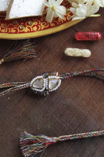 Trillion kundan and bead rakhi with roli chawal