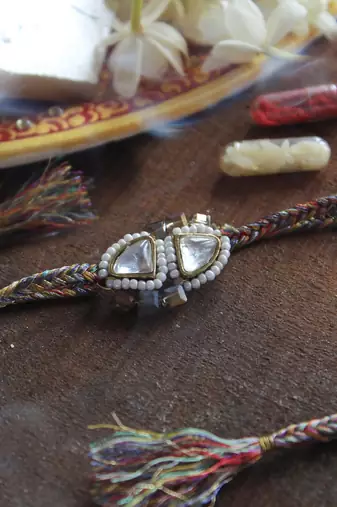 Trillion kundan and bead rakhi with roli chawal