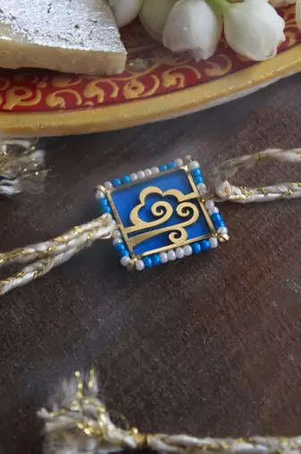 Free spirited beaded rakhi with roli chawal