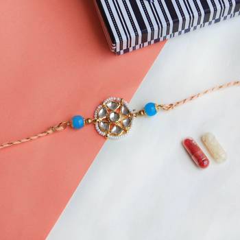 Floral kundan rakhi with roli chawal 1
