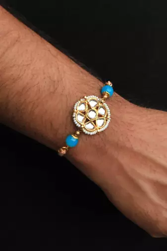Floral kundan rakhi with roli chawal