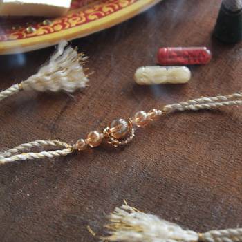 Gleaming beads rakhi with roli chawal 1