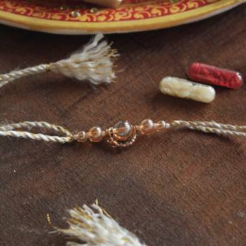 Gleaming beads rakhi with roli chawal 3