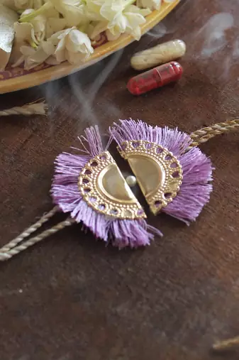 Lilac tassel rakhi with roli chawal