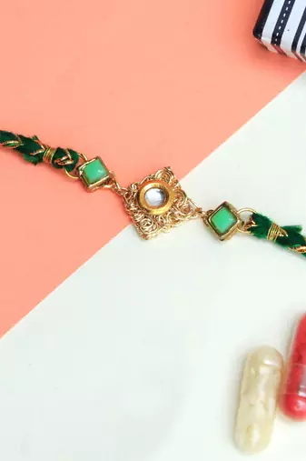 Green kundan with mesh rakhi with roli chawal