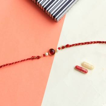 Classic red & gold rakhi with roli chawal 1
