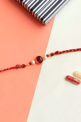 Classic red & gold rakhi with roli chawal