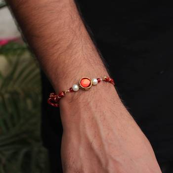Classic red & gold rakhi with roli chawal 3