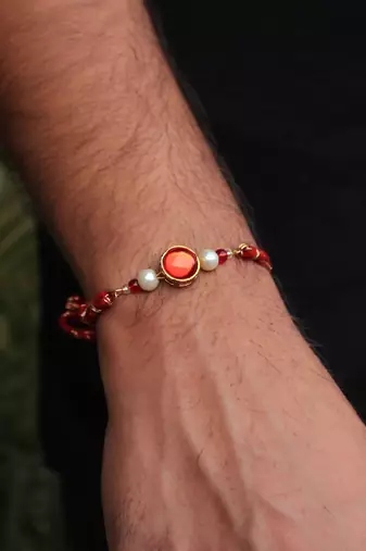 Classic red & gold rakhi with roli chawal