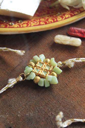 Lush green rakhi with roli chawal