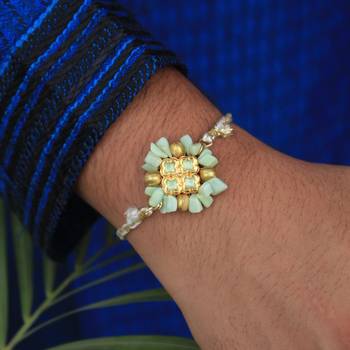 Lush green rakhi with roli chawal 2