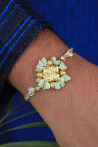 Lush green rakhi with roli chawal