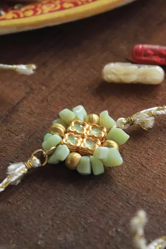 Lush green rakhi with roli chawal