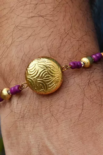 Golden crescent rakhi with roli chawal