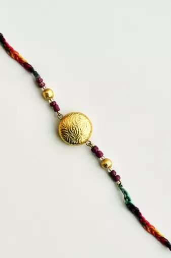 Golden crescent rakhi with roli chawal