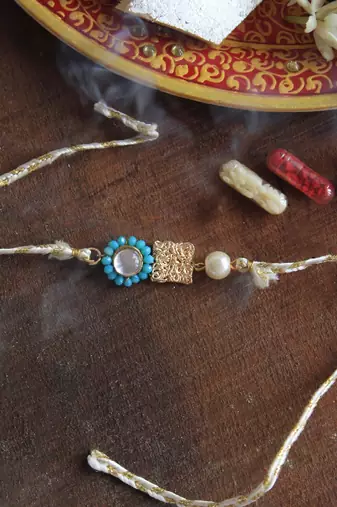 Skyey kundan pearl rakhi with roli chawal