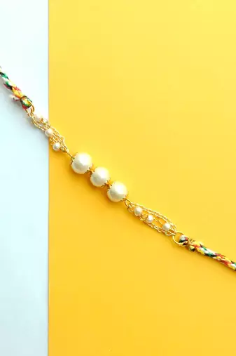 Pearly rakhi with roli chawal