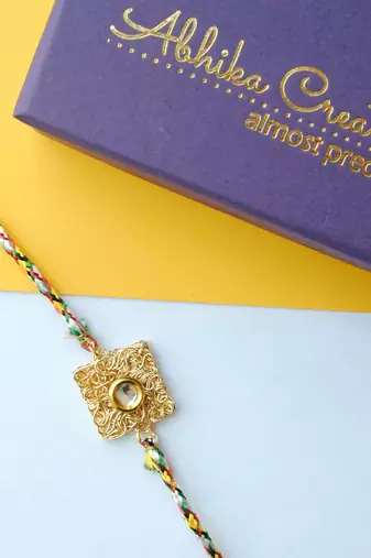 Square mesh rakhi with roli chawal
