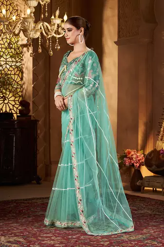 Blue net embroidery work saree with unstitched blouse piece