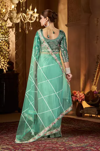 Blue net embroidery work saree with unstitched blouse piece