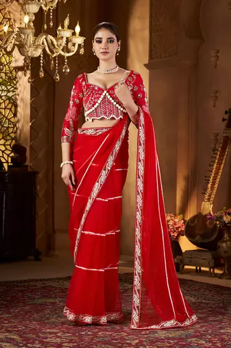 Red net embroidery work saree with unstitched blouse piece