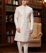 Cream sherwani with imported jacquard silk and faux satin pajama for mens