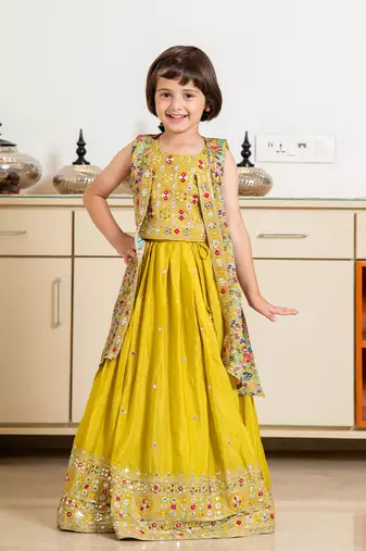 Yellow silk blend embroidered sleeveless party lehenga with shrug for girls