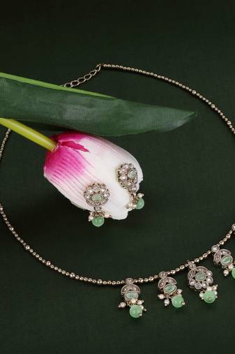 Delightful leaf and oval shape crystal gold plated matinee  for women and girls