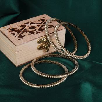 Classy pearl antique gold plated set of 4 bangles for women and girls 1