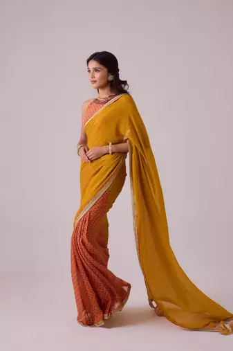 Yellow plain georgette saree with embroidered blouse