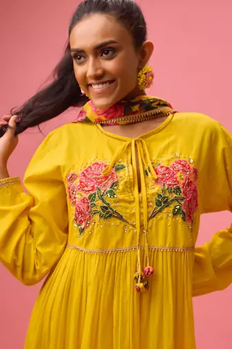 Yellow cotton floral embroidered kalidar paired with dupatta and churidar