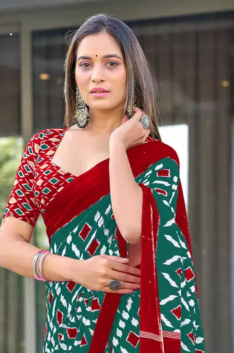 Teal mulcotton ikat print saree with unstitched blouse piece