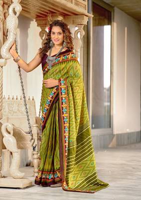 Green mulcotton ikat print saree with unstitched blouse piece 1