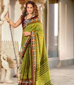 Green mulcotton ikat print saree with unstitched blouse piece