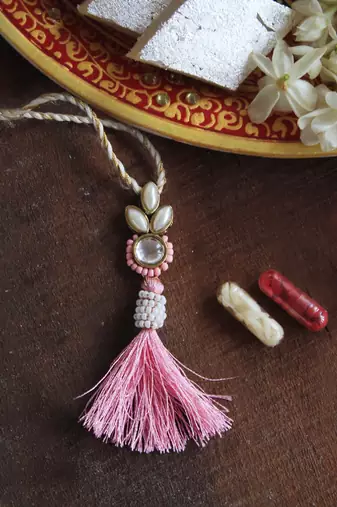 Blush kundan lumba with roli chawal