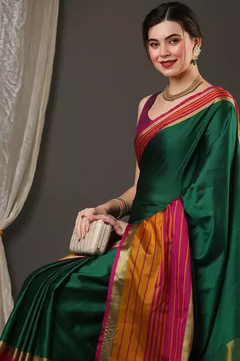 Dark green border silk blend saree with contrast  blouse
