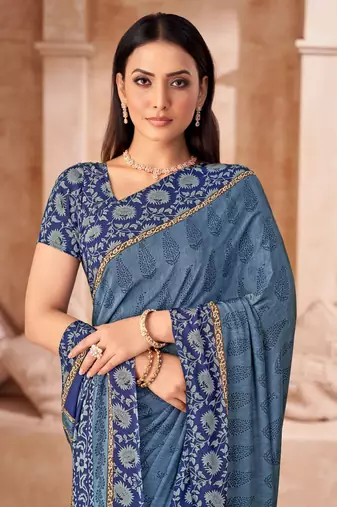Pastel blue printed crepe silk saree with unstitched blouse piece