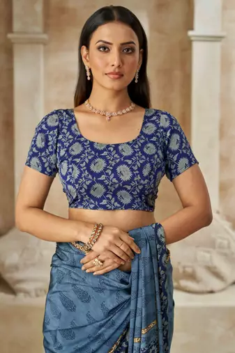 Pastel blue printed crepe silk saree with unstitched blouse piece