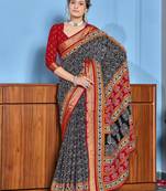 Black cotton ajrakh print saree with contrast blouse piece